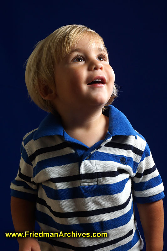 baby,toddler,2-year-old,boy,blonde,blond,happy,childhood,portrait,flash,softbox,blue,wonder,amazement,